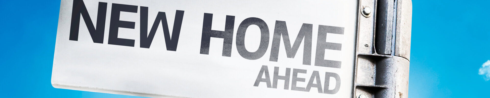 New Home Written On The Road Sign
